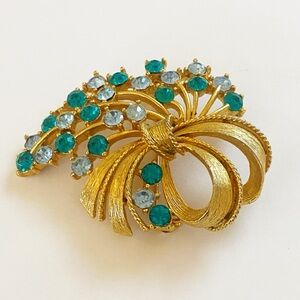 Vintage Lisner blue rhinestone gold tone bow brooch